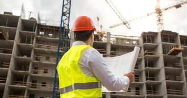 An engineer working at a construction site to represent incentive plans for civil construction workers.